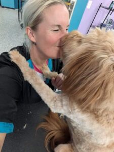 FB_IMG_1724461583033 brown dog giving groomer a kiss